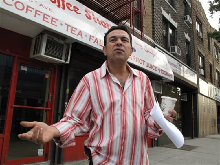 Mousa Ahmad stands in front of the empty storefront where he used to run a coffee shop in Brooklyn, N.Y. Ahmad says he had to close the coffee shop because police surveillance was scaring away customers.